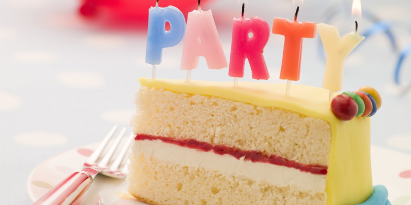 Party Candles on a Slice of Birthday Cake